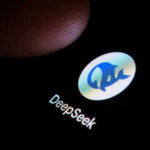 Finger touching phone screen showing DeepSeek logo