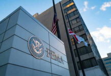 FEMA building with flags outside and blue sky