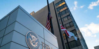 FEMA building with flags outside and blue sky