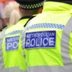 Anti-Muslim Motive? Investigators Tight-Lipped Two police officers in high-visibility jackets at a public event