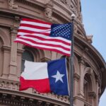 Texas Court Delivers Major Immigration Setback American and Texas flags flying in front of a government building