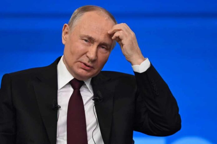 A political leader appearing thoughtful during a press conference