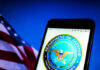Department of Defense logo on smartphone screen flag