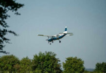 Training Flight HORROR — Unthinkable Move Mid-Air Small airplane flying over green trees and clear sky