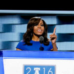 I dont know who this is speaking at a podium
