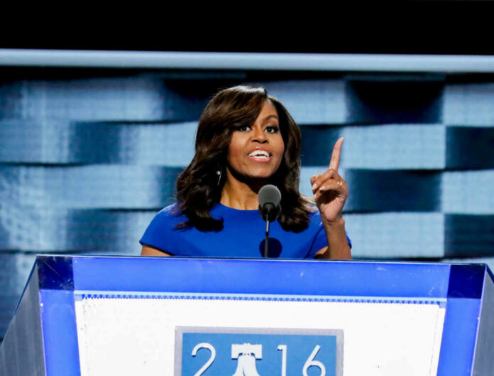 michelle-obama-delivers-her-speech1221256123jpg I dont know who this is speaking at a podium