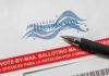 Election Mistakes Keep Fueling Voter Distrust Mail-in ballot envelope with pen