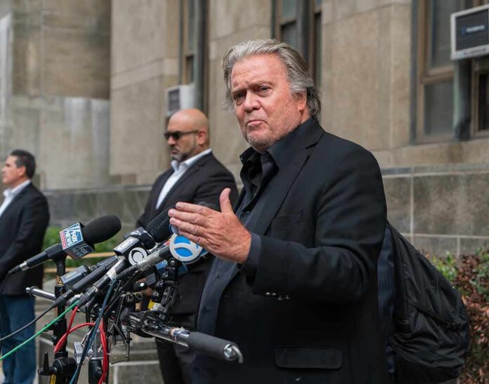 shutterstock_2199562659 man in black suit speaking at outdoor press conference