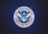 Conservative Ally Questions Trump’s Immigration Numbers U.S. Department of Homeland Security seal on a blue brick wall