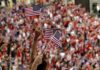 A Patriotic Celebration Americans Won’t Soon Forget Fans waving American flags in a crowded stadium