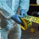 Global Dragnet Over Monaco Blast—But Where’s Proof? forensic investigators unrolling yellow barrier tape at night