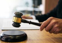 A Horrific Crime Meets A Rare Legal Exception Judge's hand holding a gavel over a sound block