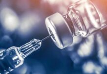 Influencer Army? White House Playbook Leaks syringe needle drawing liquid from a vaccine vial