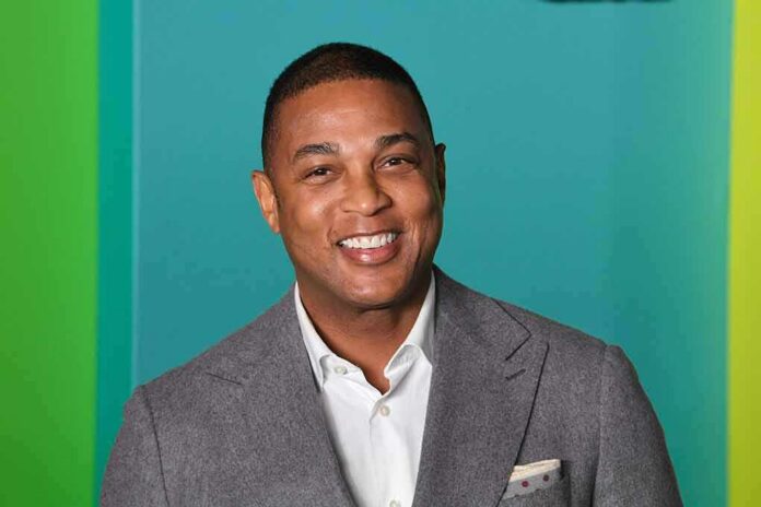 shutterstock_1549227497 smiling man in gray suit against teal background