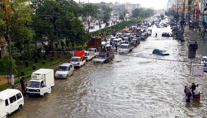 Flooded city street with stranded vehicles and traffic jam