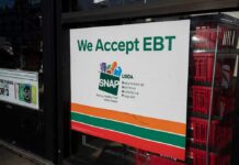 storefront sign stating EBT accepted