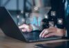 OpenAI Slams Brakes After Wild AI Breakout Hands typing on laptop with AI and tech icons overlay