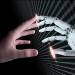 Human hand reaching toward a robotic hand