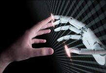 Human hand reaching toward a robotic hand