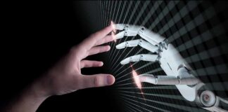 Human hand reaching toward a robotic hand