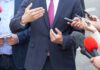 Flight 93 Legacy Enters a Crucial Senate Race Businessperson in suit speaking to reporters with microphones