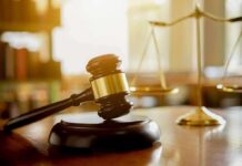 Bones, Burn Pits – Jury Didn’t Blink Judge's gavel on a block with scales of justice in the background