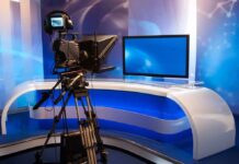 Television studio with camera and news desk
