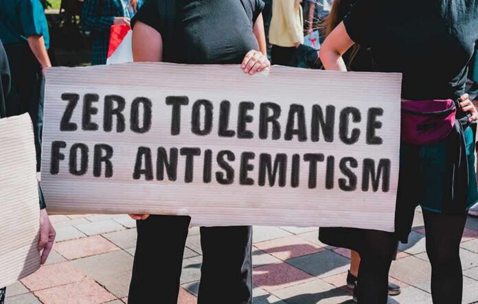 Protester holding a large sign at a rally
