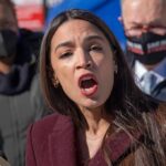 woman speaking passionately at outdoor event