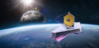 space telescope with gold hexagonal mirror orbiting above Earth