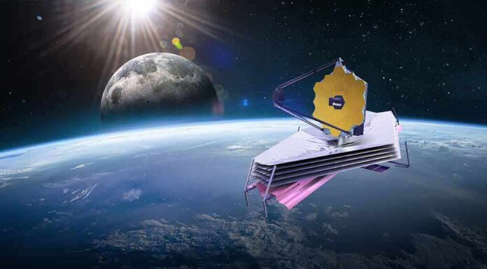 space telescope with gold hexagonal mirror orbiting above Earth