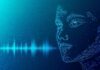 Digital wireframe face with audio waveform