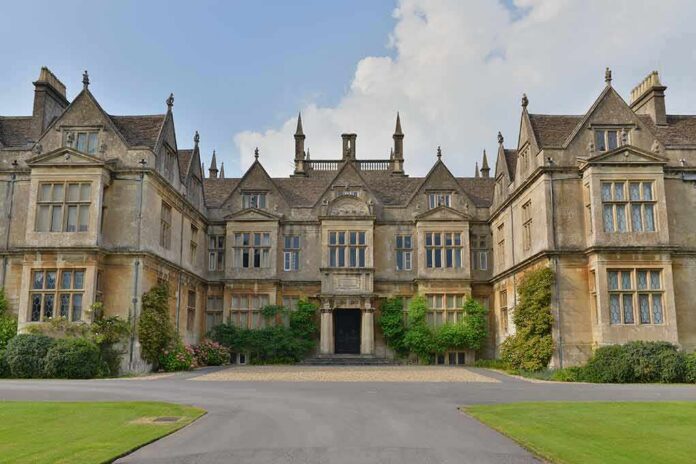 Historic mansion with ornate stone facade and gabled roofs