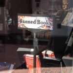 Bookstore window display with banned books sign