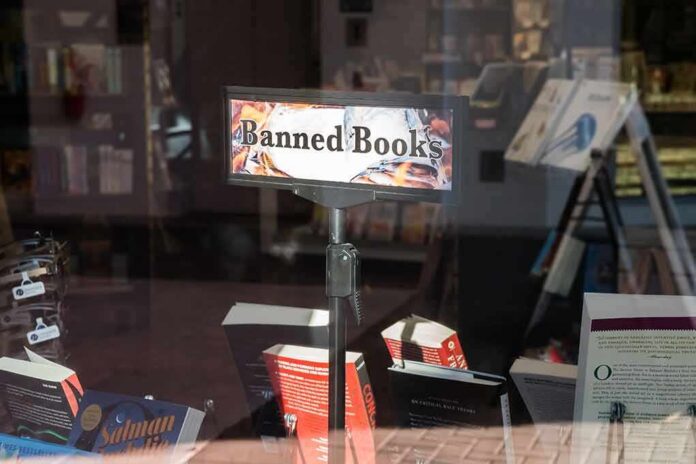 Bookstore window display with banned books sign