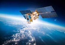 Satellite with solar panels orbiting above Earth