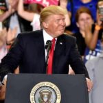 Donald Trump at a podium during a rally