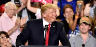 Donald Trump at a podium during a rally