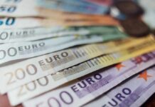 Euro banknotes fanned out on a surface