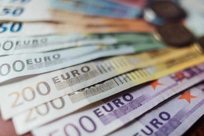 Euro banknotes fanned out on a surface