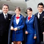 Airline crew standing together on the tarmac