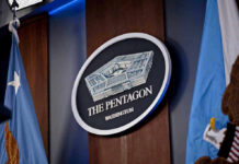 Hegseth Axes J-5 Boss – No Backup The Pentagon emblem between two flags.