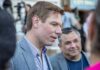 Eric Swalwell speaking with people at an outdoor event