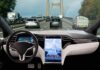Self-driving car interior on a busy bridge highway