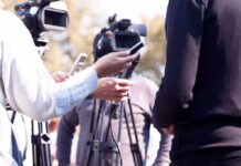 Does Dangerous Rhetoric Have a Double Standard? press interview with microphones and cameras outdoors