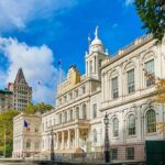 City hall building with classical architecture under a blue sky