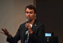 Rifle Link Crumbles – What’s Missing? man speaking into a microphone during a talk