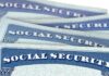 Tax Hike Or Cuts – Senate’s Stark Ultimatum Social Security cards stacked in a close-up view