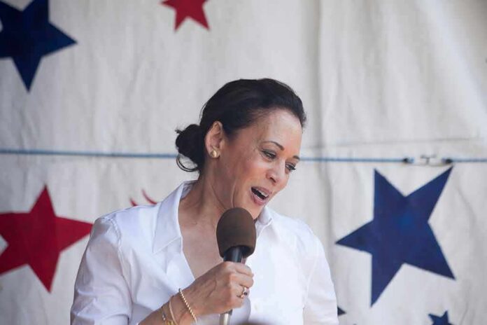 shutterstock_1444531697 woman speaking into a microphone on a star-patterned backdrop