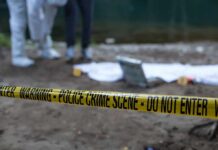 Hidden Safe, Buried Bones – What’s Inside? Police crime scene with yellow tape and forensic team
